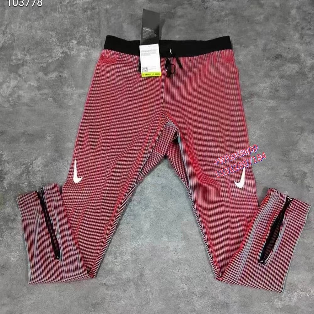Nike Jackets Trail hooded zip-up windbreaker — Red ribbed leggings