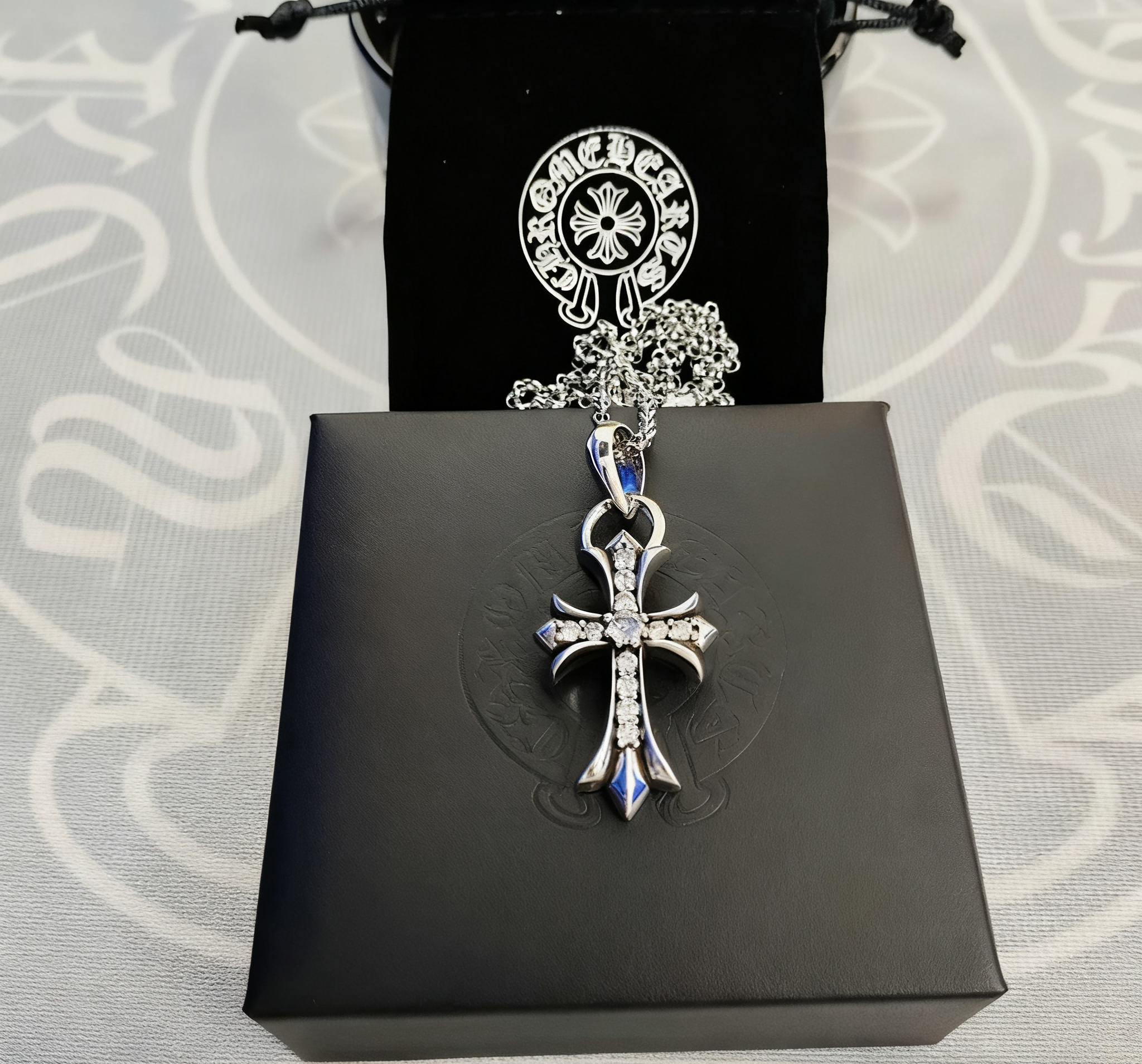 Cross pendant with rhinestones and a pearl chain SKU image