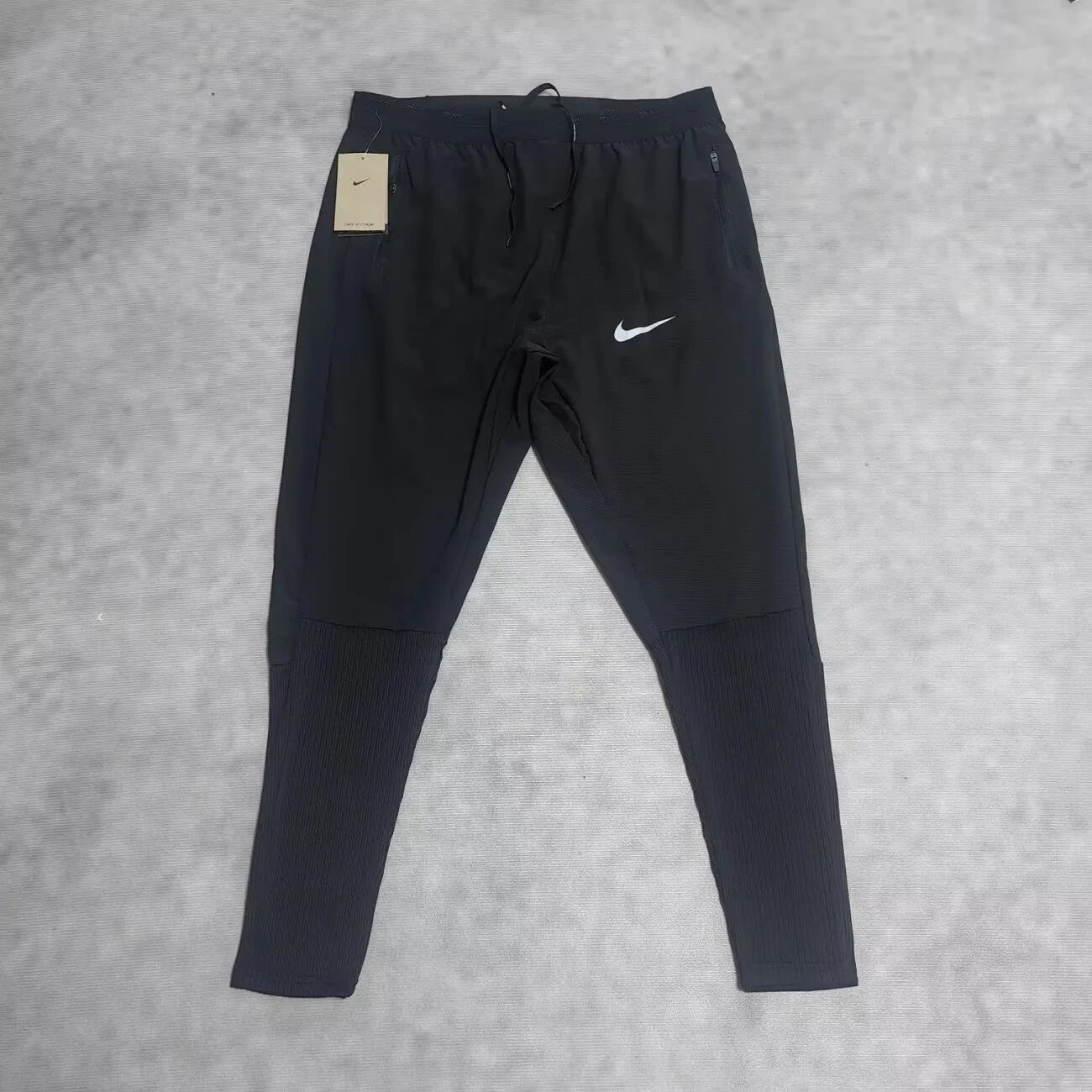 Black Track Pants with Single White Swoosh