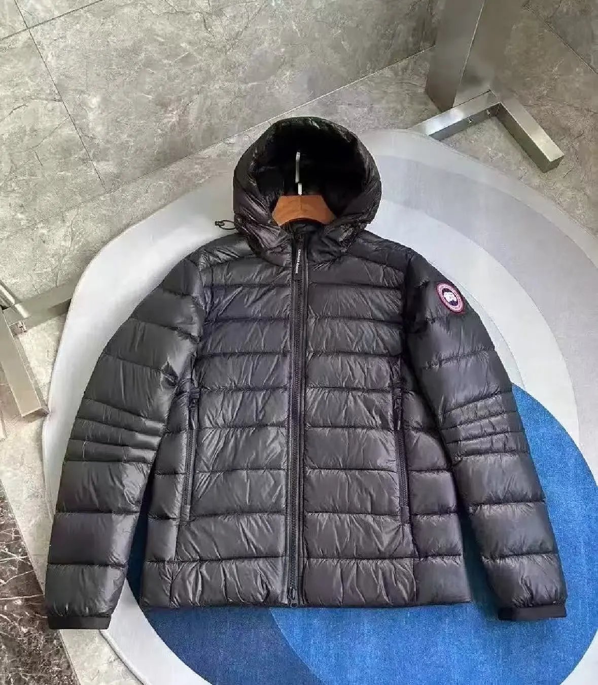 Black and red labeled down jacket