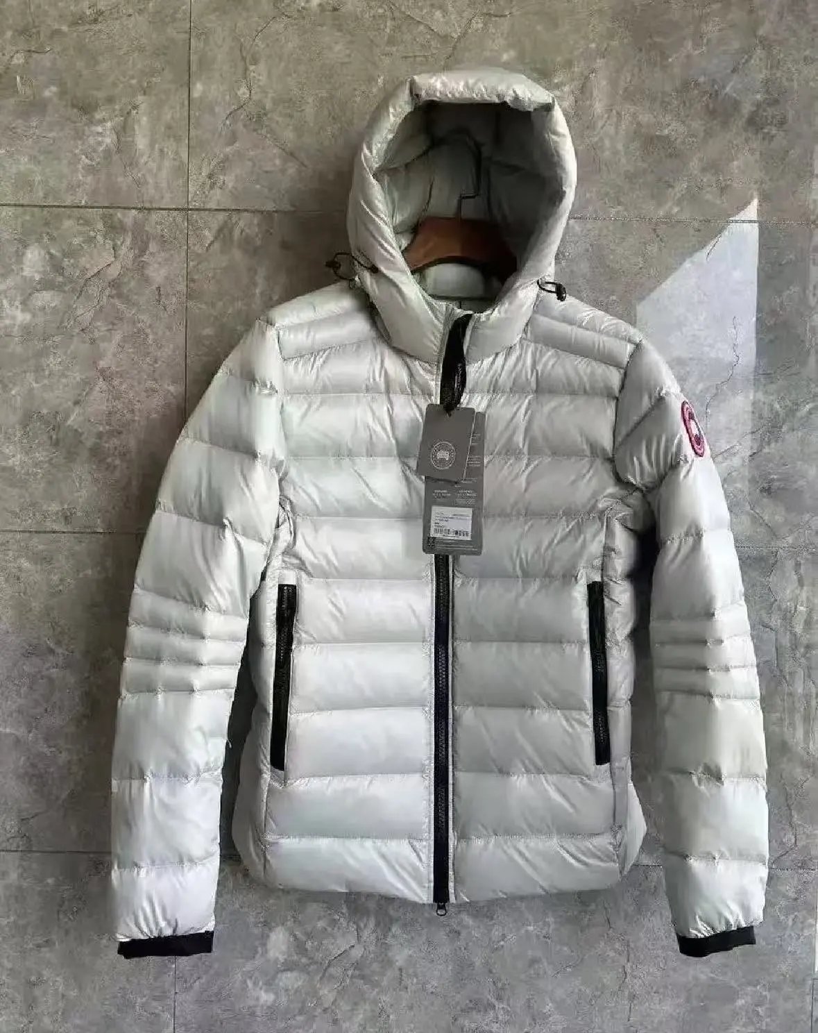 White and red labeled down jacket