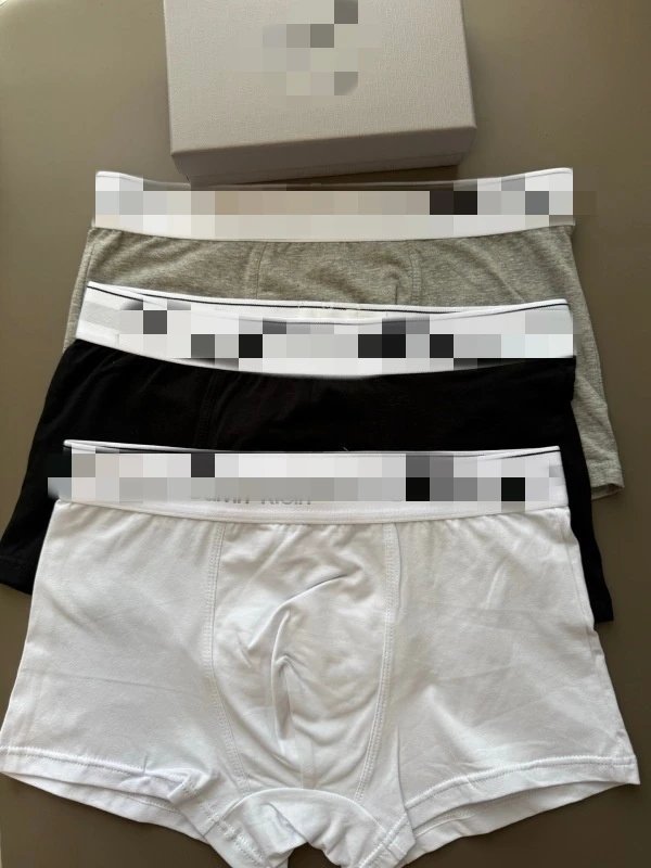 One box of three (black, white, gray)