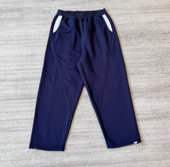 Deep blue paired with white pants