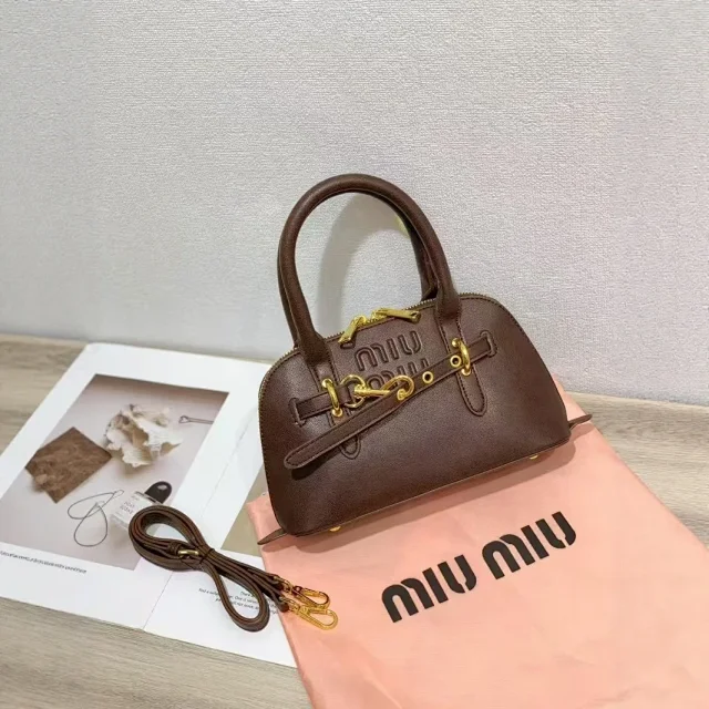 Miu Handbags Dome handbag with belt-style gold-tone hardware and detachable shoulder strap product detail image 2