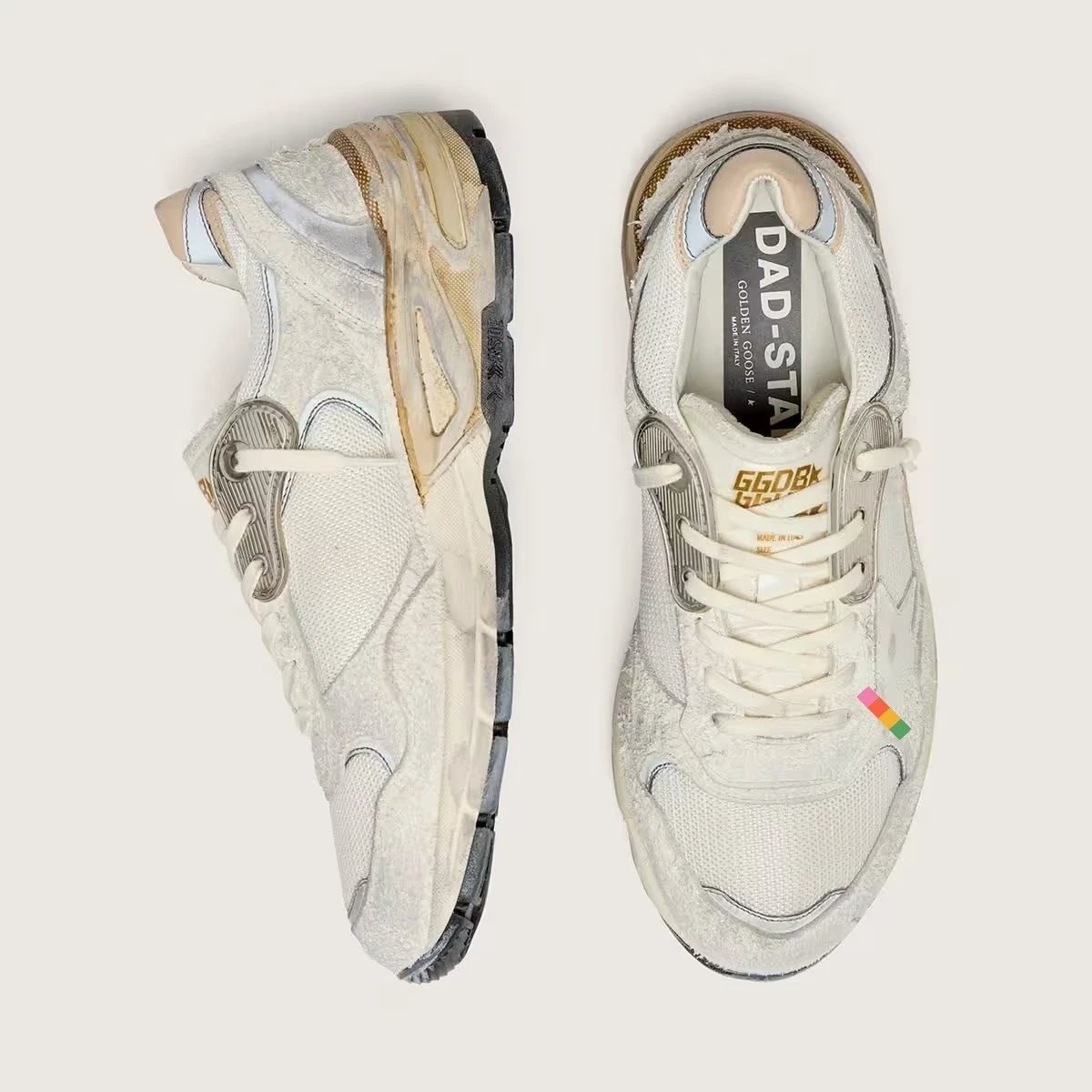 Golden Goose Sneakers Dad-Star distressed lace-up — White with a yellow background