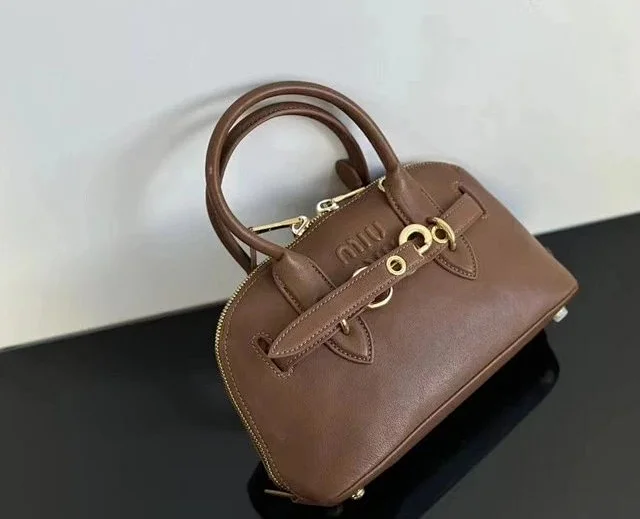 Miu Handbags Dome handbag with belt-style gold-tone hardware and detachable shoulder strap product detail image 3
