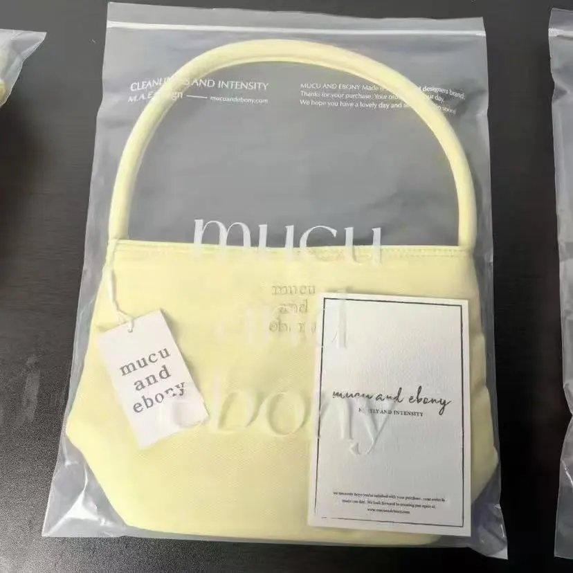 Mucu and Ebony Shoulder Bags Small top-handle bag — Milk yellow