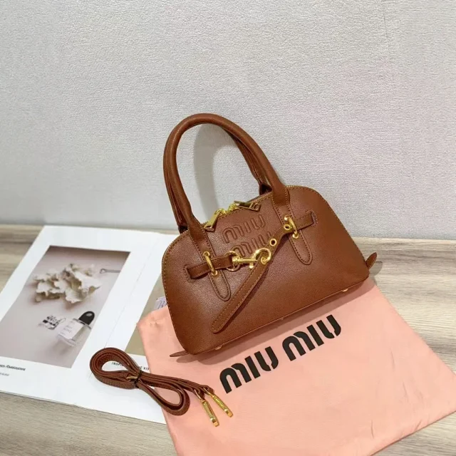 Miu Handbags Dome handbag with belt-style gold-tone hardware and detachable shoulder strap product detail image 4