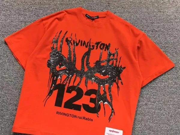 Design Rivington x Melanoma 123 Distorted Graphic Orange T-Shirt T-Shirts - 1
