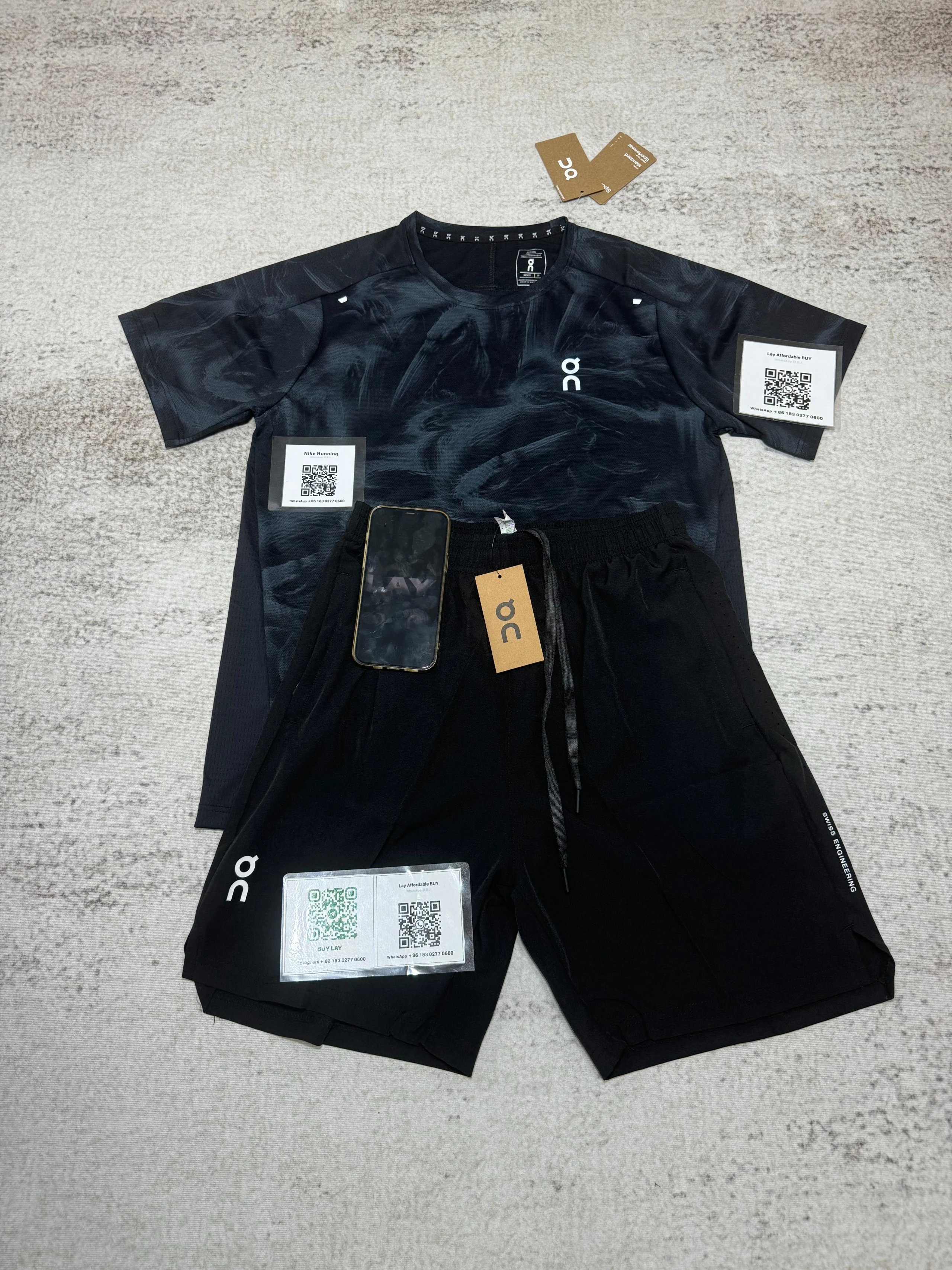 On Matching Sets Marble-print short-sleeve T-shirt and shorts set — Black suit