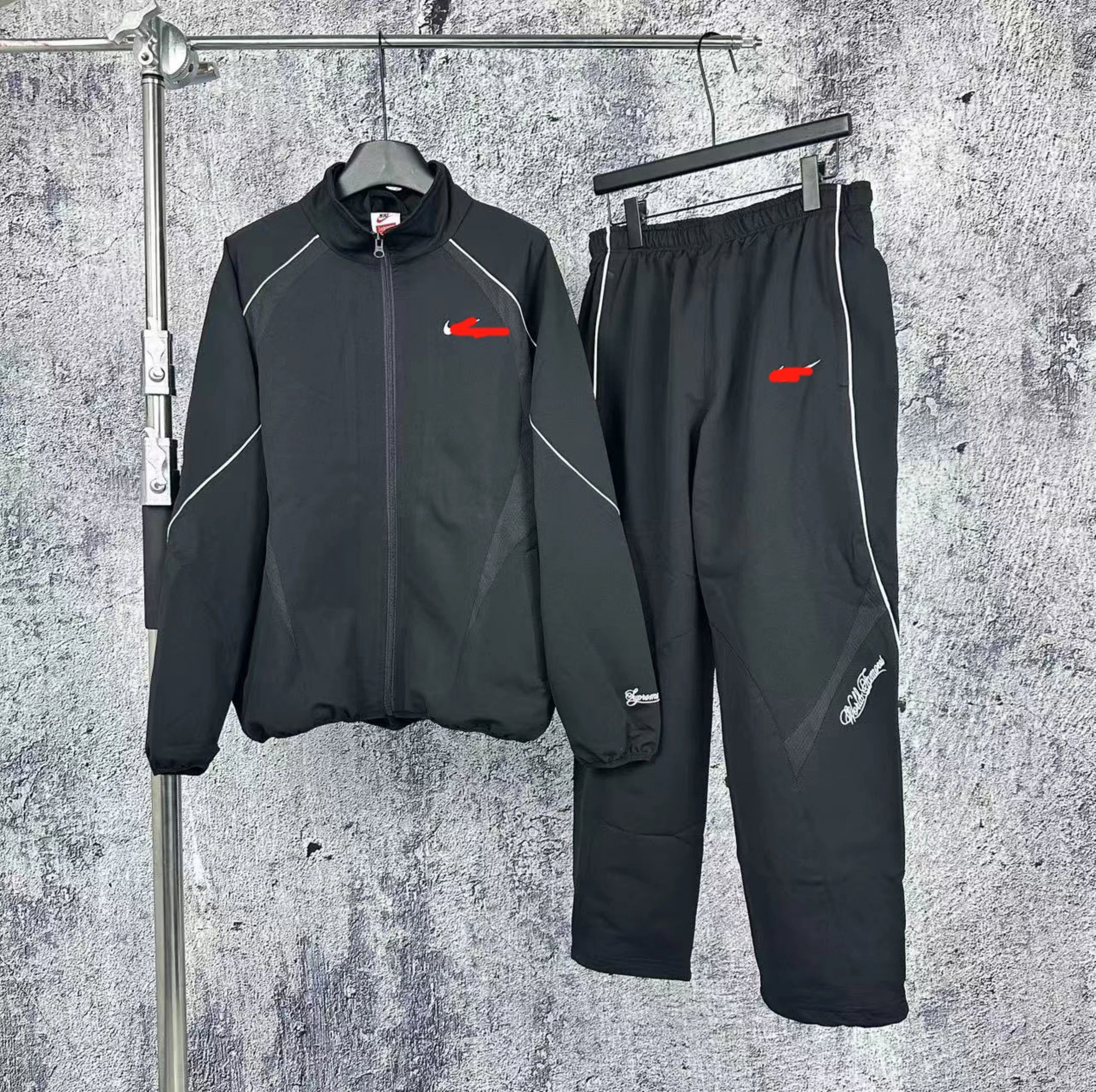Nike Supreme Black Tracksuit Set with White Piping and Script Embroidery