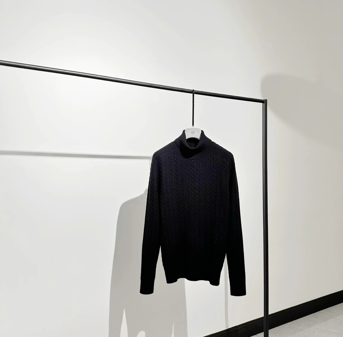 LP style high neck pure wool pullover sweater Twisted patterns interweave, creating a delicate texture on a black base that feels soft and smooth to the touch. Visually, there is a subtle layering ingenuity hidden within