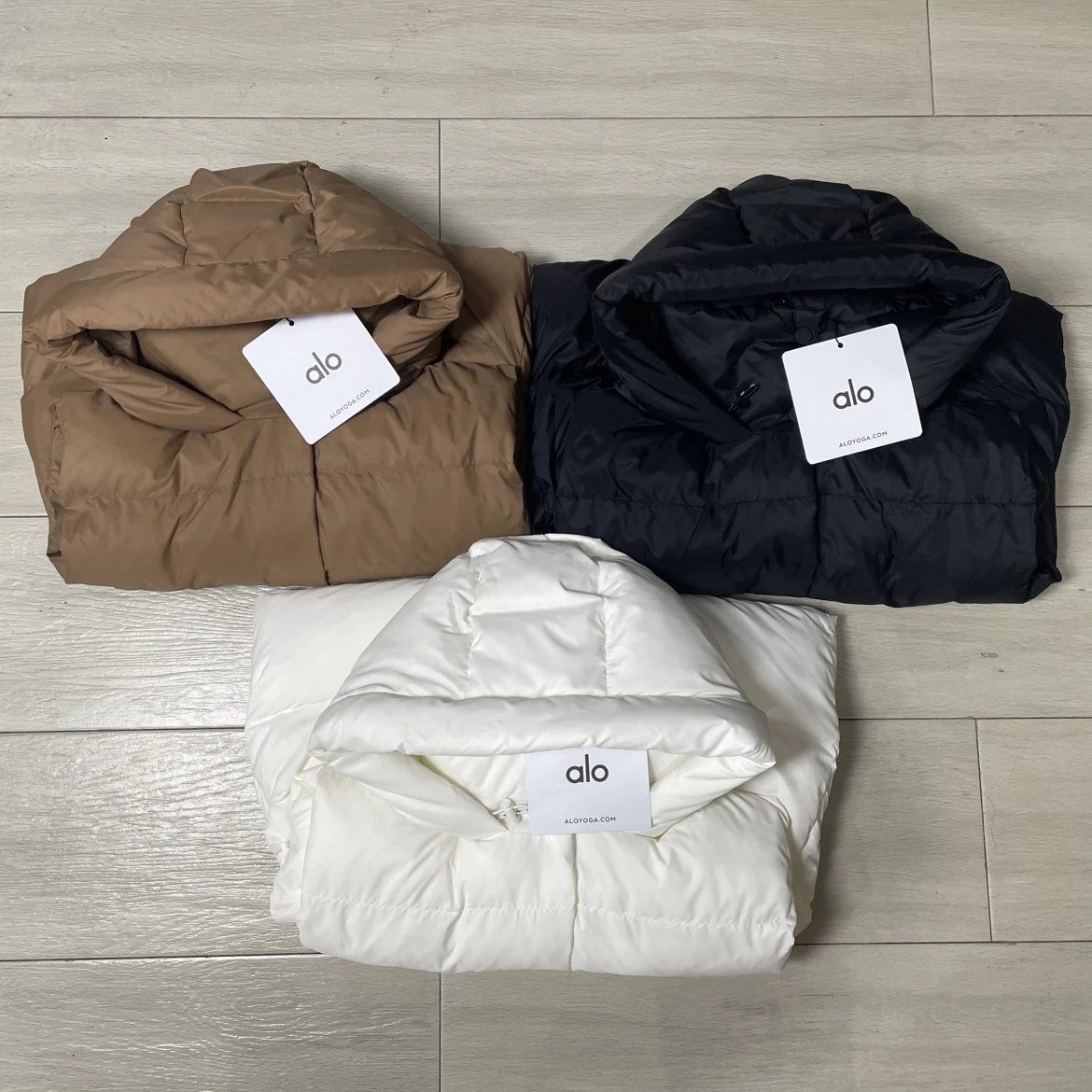 Alo Yoga Puffer Jacket in Brown, Black, and White