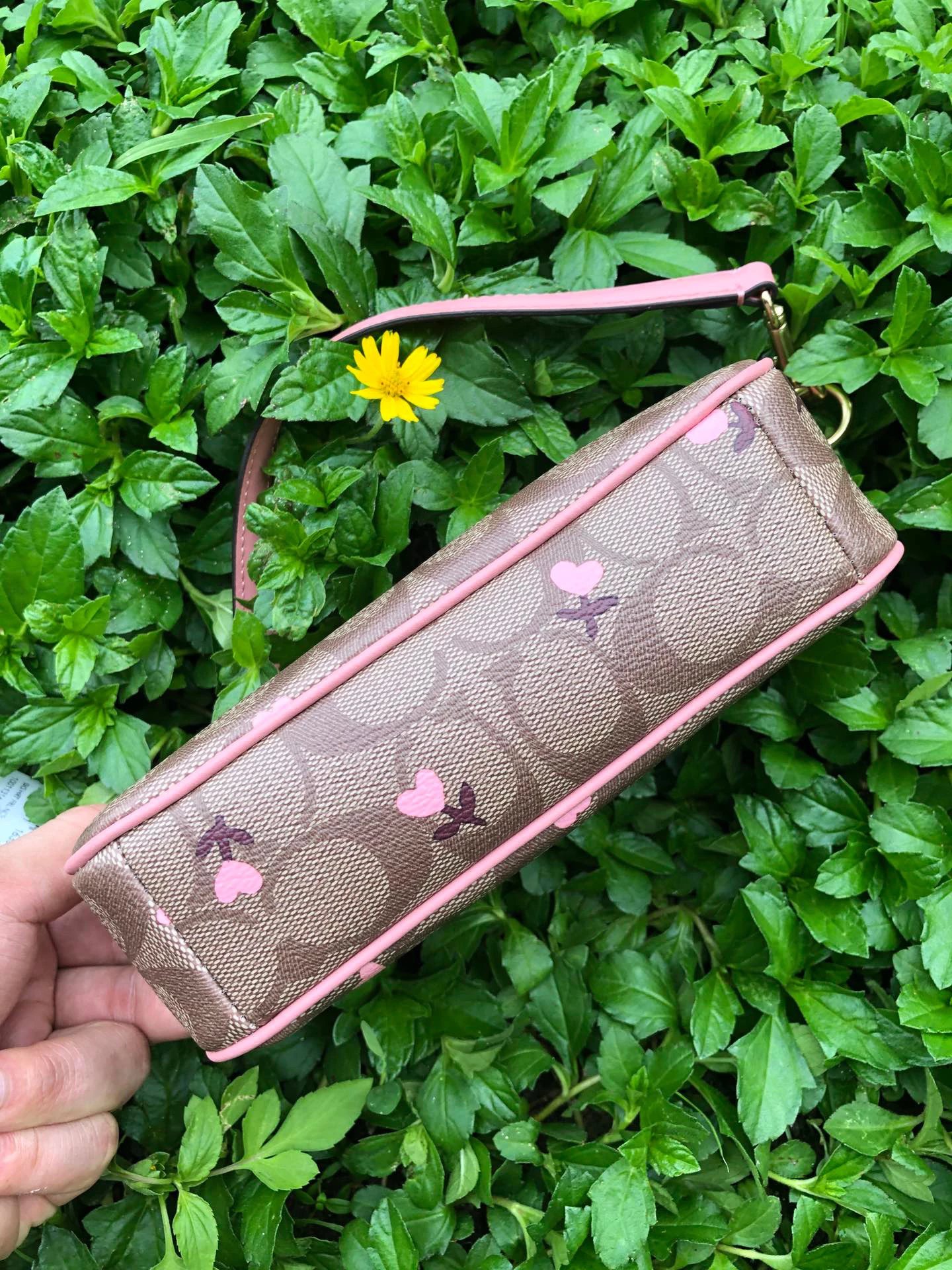 Coach Nolita Barrel Bag In Signature Canvas With Heart Print