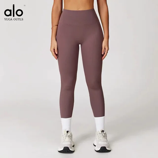 Alo Yoga Racerback sports bra with high-waisted shorts or flared leggings product detail image 19