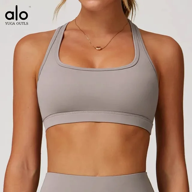 Alo Yoga Racerback sports bra with high-waisted shorts or flared leggings product detail image 9