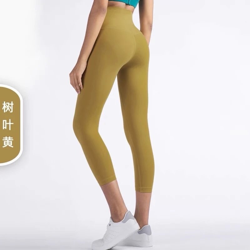 Alo Yoga Trousers High-rise 7/8 leggings — The leaves have turned yellow.