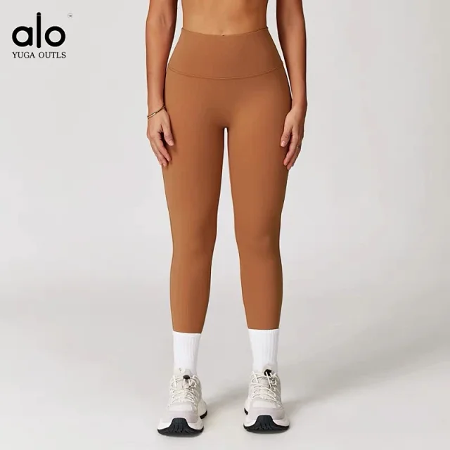 Alo Yoga Racerback sports bra with high-waisted shorts or flared leggings product detail image 17