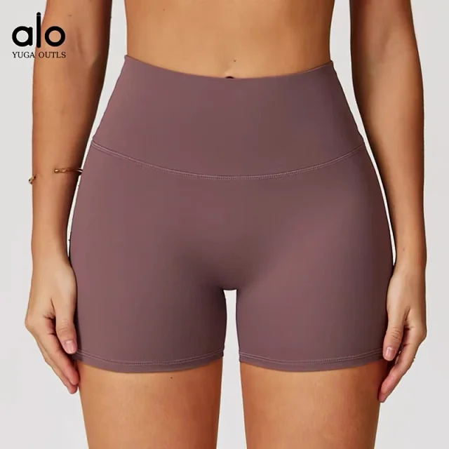 Alo Yoga Racerback sports bra with high-waisted shorts or flared leggings product detail image 14