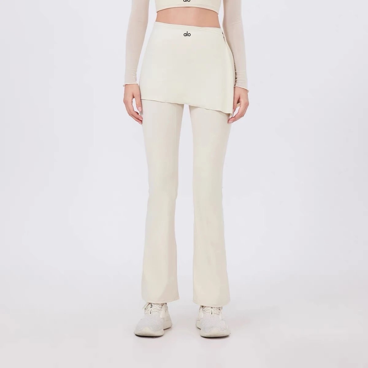 Alo Yoga Trousers High-waisted flared leggings with wrap skirt overlay — Milky apricot color