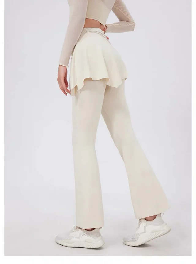 Alo Yoga Trousers High-waisted flared leggings with wrap skirt overlay product detail image 33