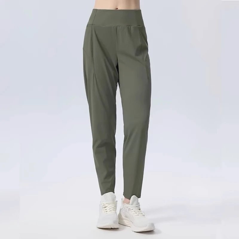 Alo Yoga Trousers High-Waisted Tapered Performance — Forest green