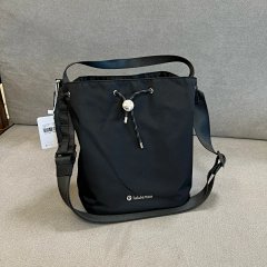 Lu Drawstring 5L Women's Drawstring Bucket Bag This crossbody bag features a classic bucket design, equipped with a handle and adjustable strap for easy styling on demand