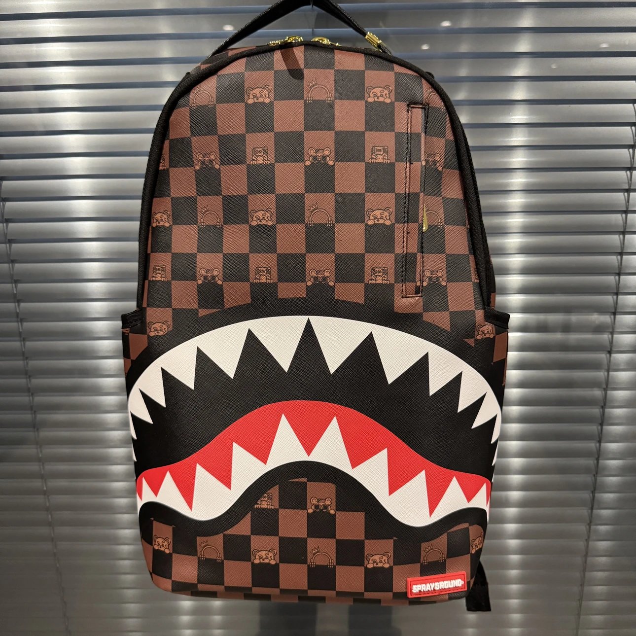 SPRAYGROUND Shark Mouth Checkered Cartoon Face Classic PVC Backpack, Unisex Couple Style with Big Shark Logo