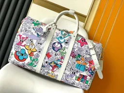 thumbnail for The Keepall Bandoulière 50 duffle bag transforms the M21863 ** version of the Monogram motif on the canvas surface