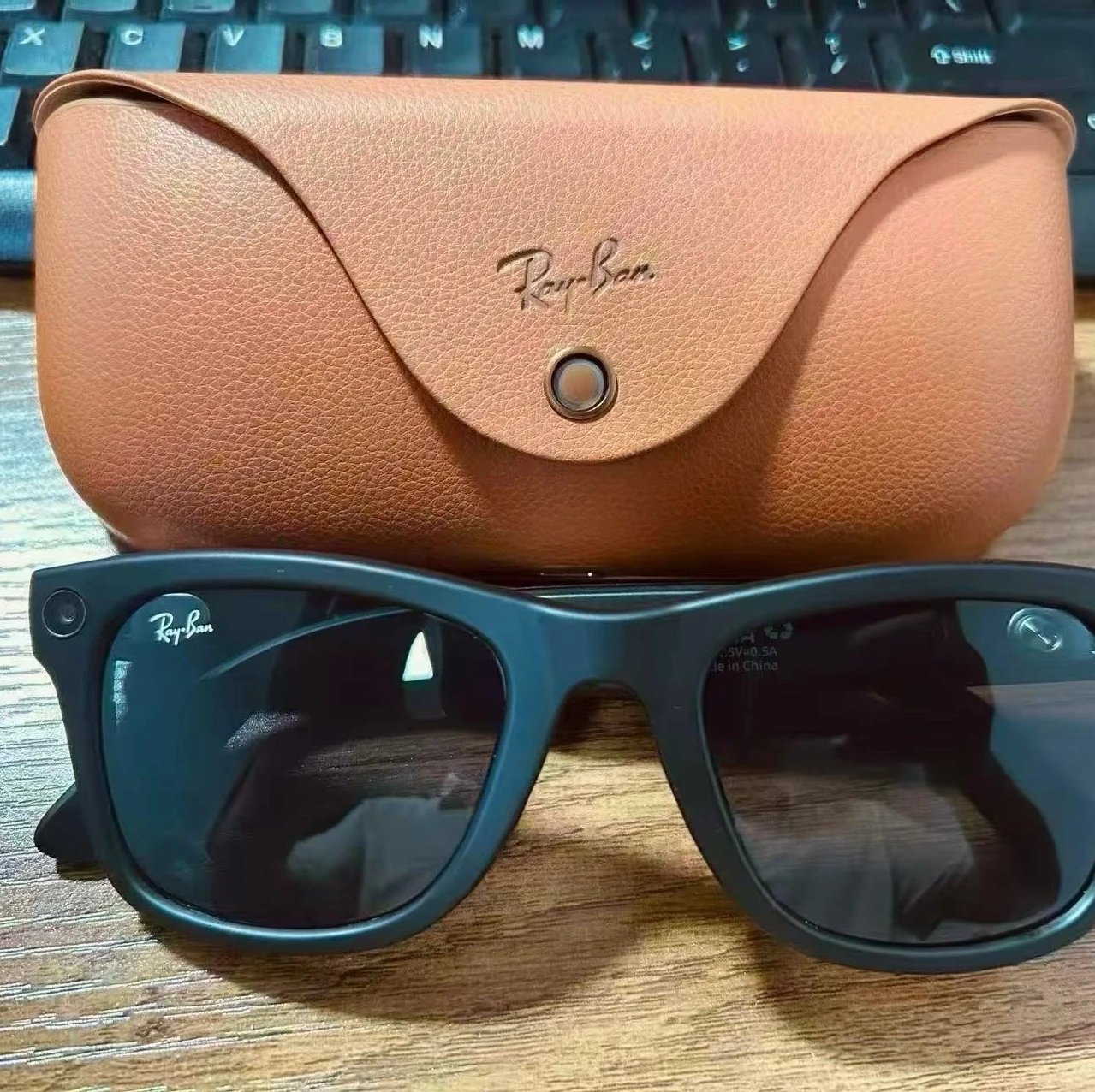 Brown leather case paired with sunglasses