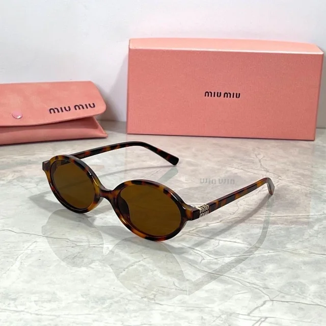 Miu Eyewear Oval sunglasses with striped metal temple detail product detail image 6