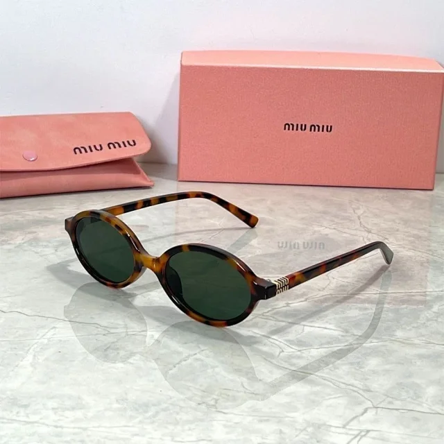 Miu Eyewear Oval sunglasses with striped metal temple detail product detail image 3