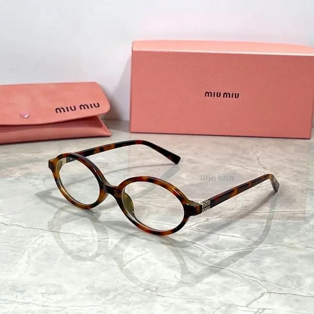 Miu Eyewear Oval sunglasses with striped metal temple detail product detail image 4