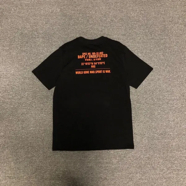 A Bathing Ape x Undefeated Camo Ape Head Orange Black T-Shirt - 6