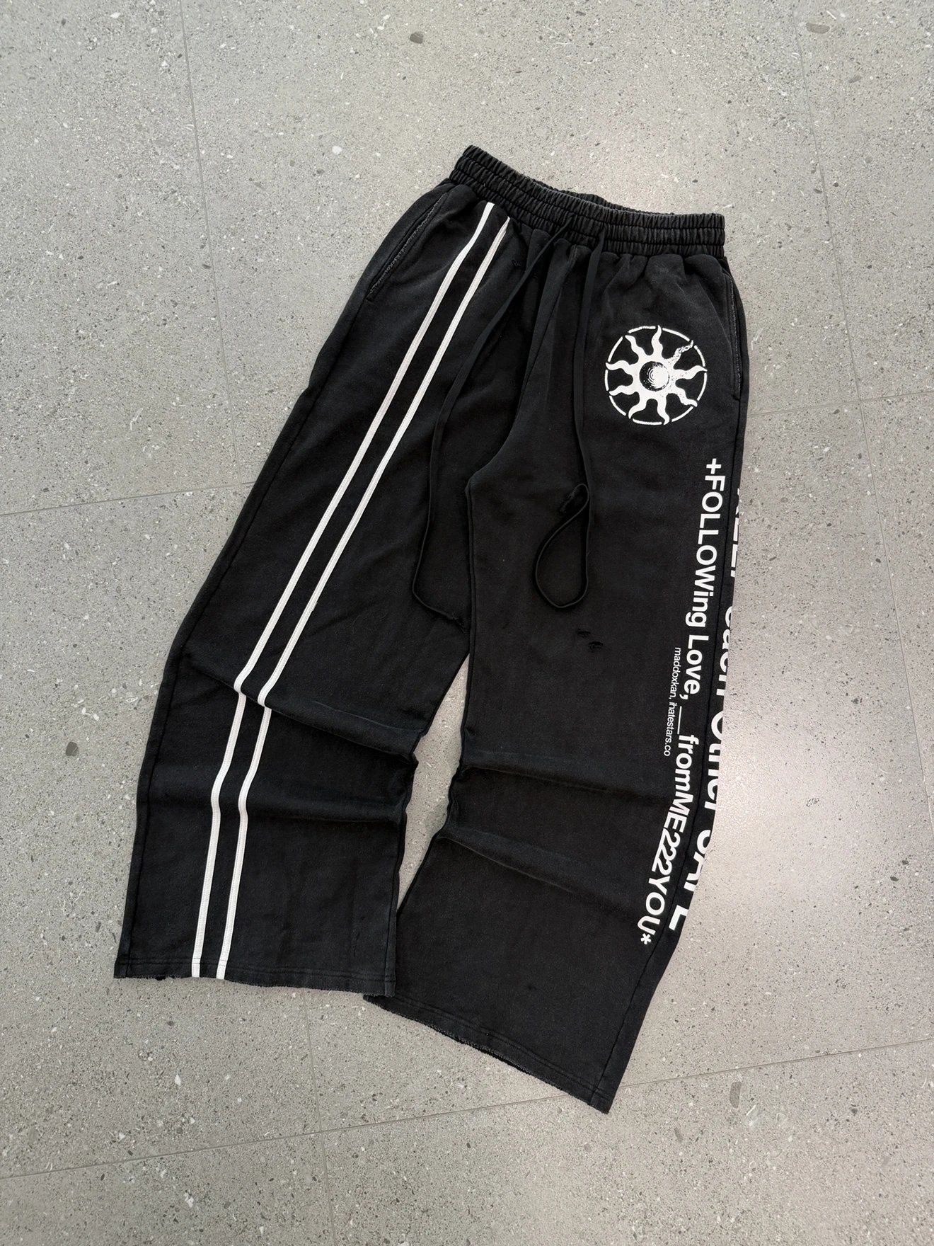 Black Track Pants With White Stripes And Sun Logo Streetwear