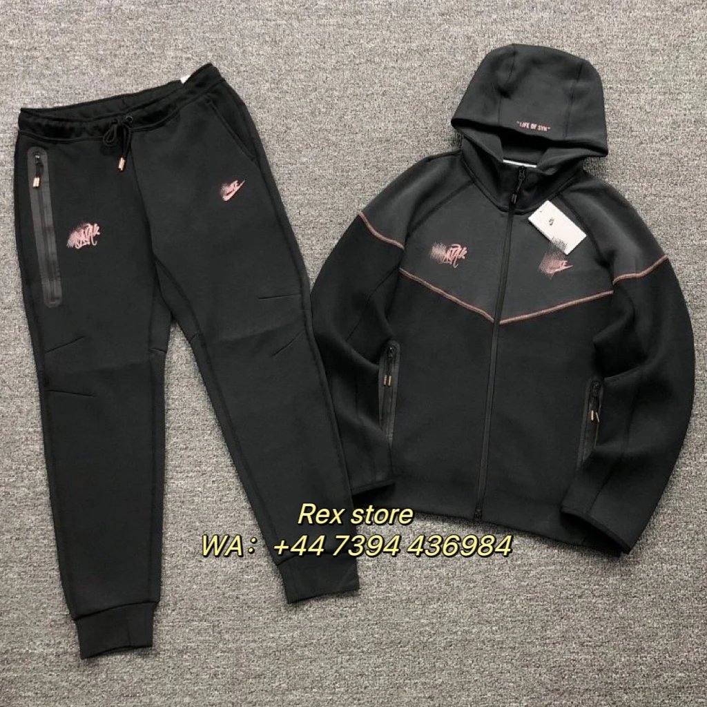 Nike Black fleece hooded zip-up jacket with rose gold piping, side zippers, and embroidered graphic; matching jogger pants with side zip pocket and drawstring waist