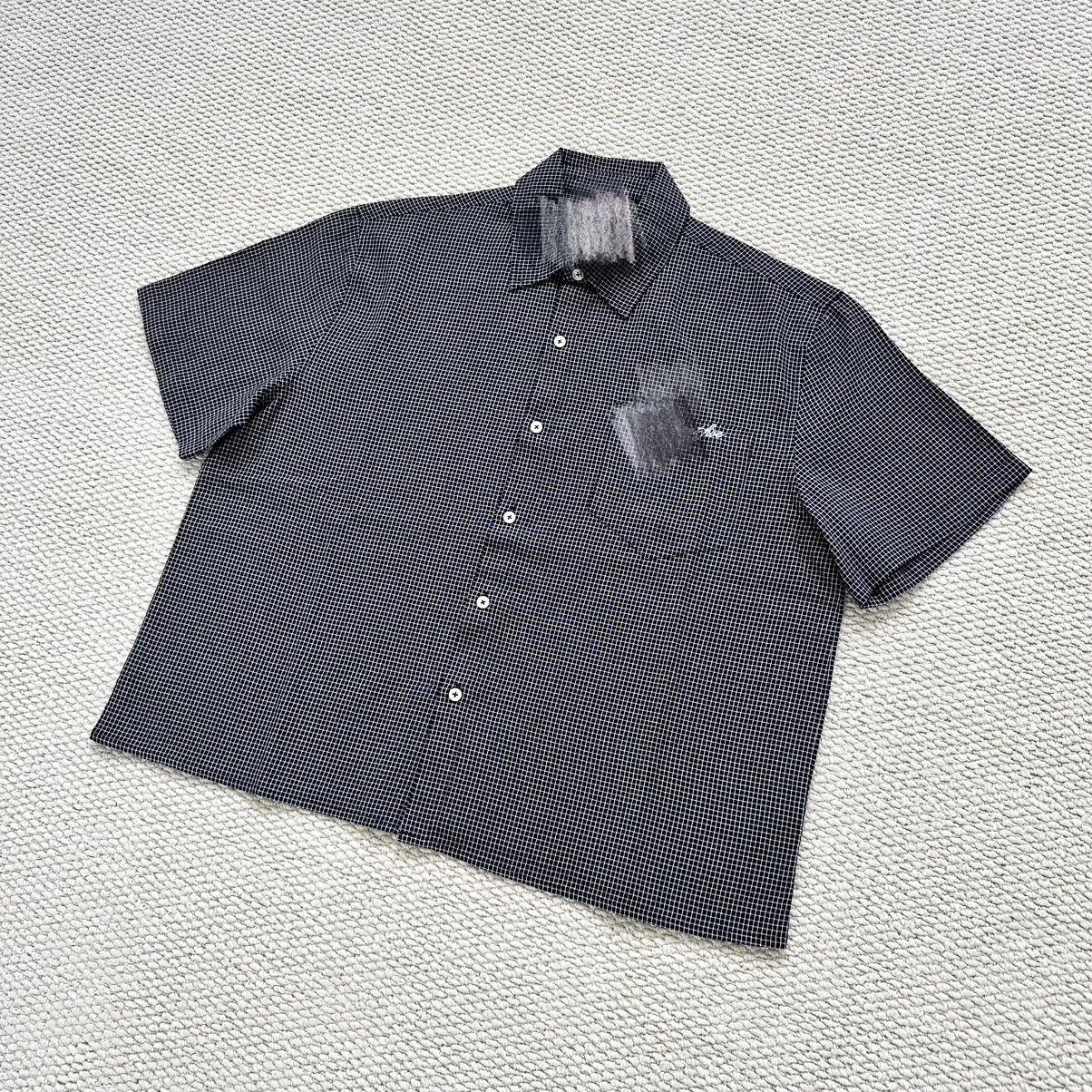 L-Exp black checkered short sleeved shirt