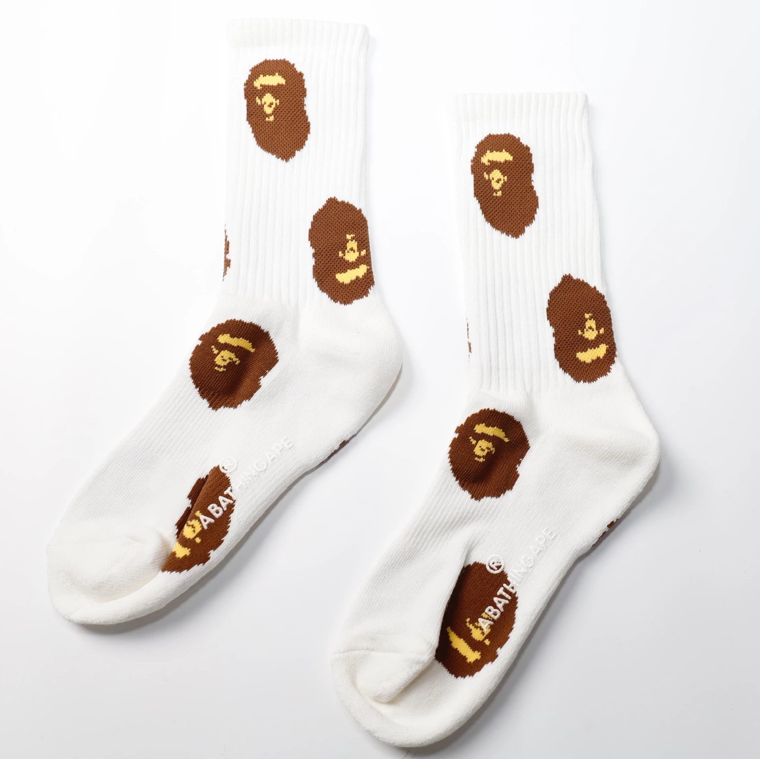 White Socks with Brown and Yellow Ape Head Pattern