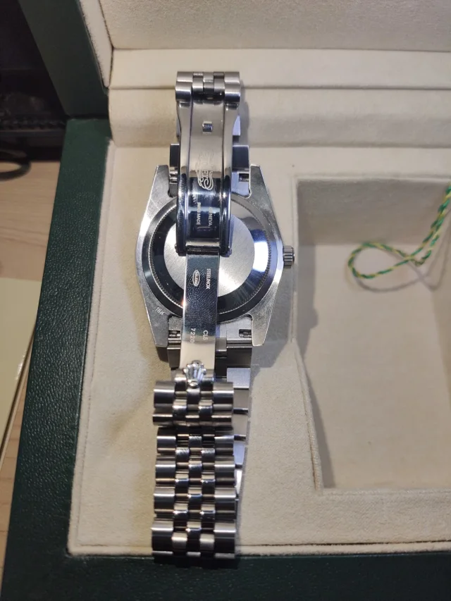 Rolex Watches Oyster Perpetual Datejust-style watch with fluted bezel, date magnifier, and jubilee bracelet product detail image 82