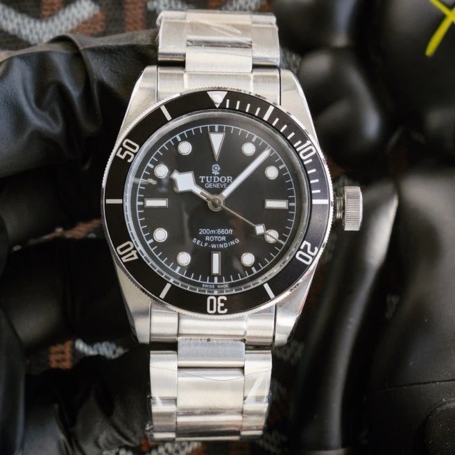 Black circle and white text (font in circular arc shape at 6 o'clock position)