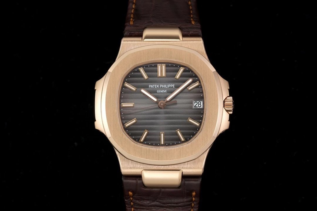 Gray dial with brown leather strap and rose gold