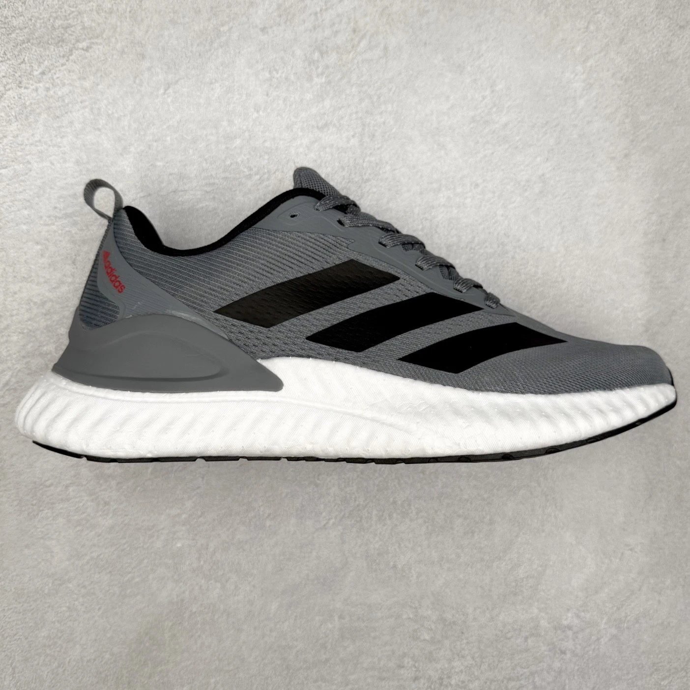 Adidas Sneakers Low-top three-stripe knit with textured foam soles — Black and gray