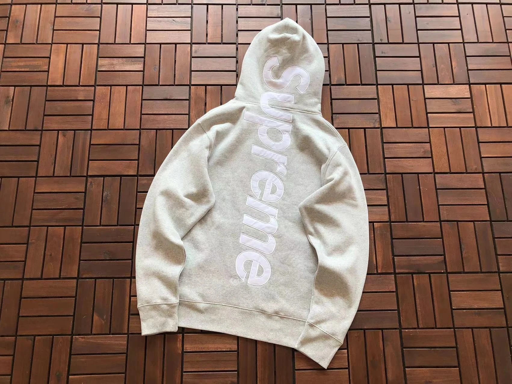 Large letters behind floral gray