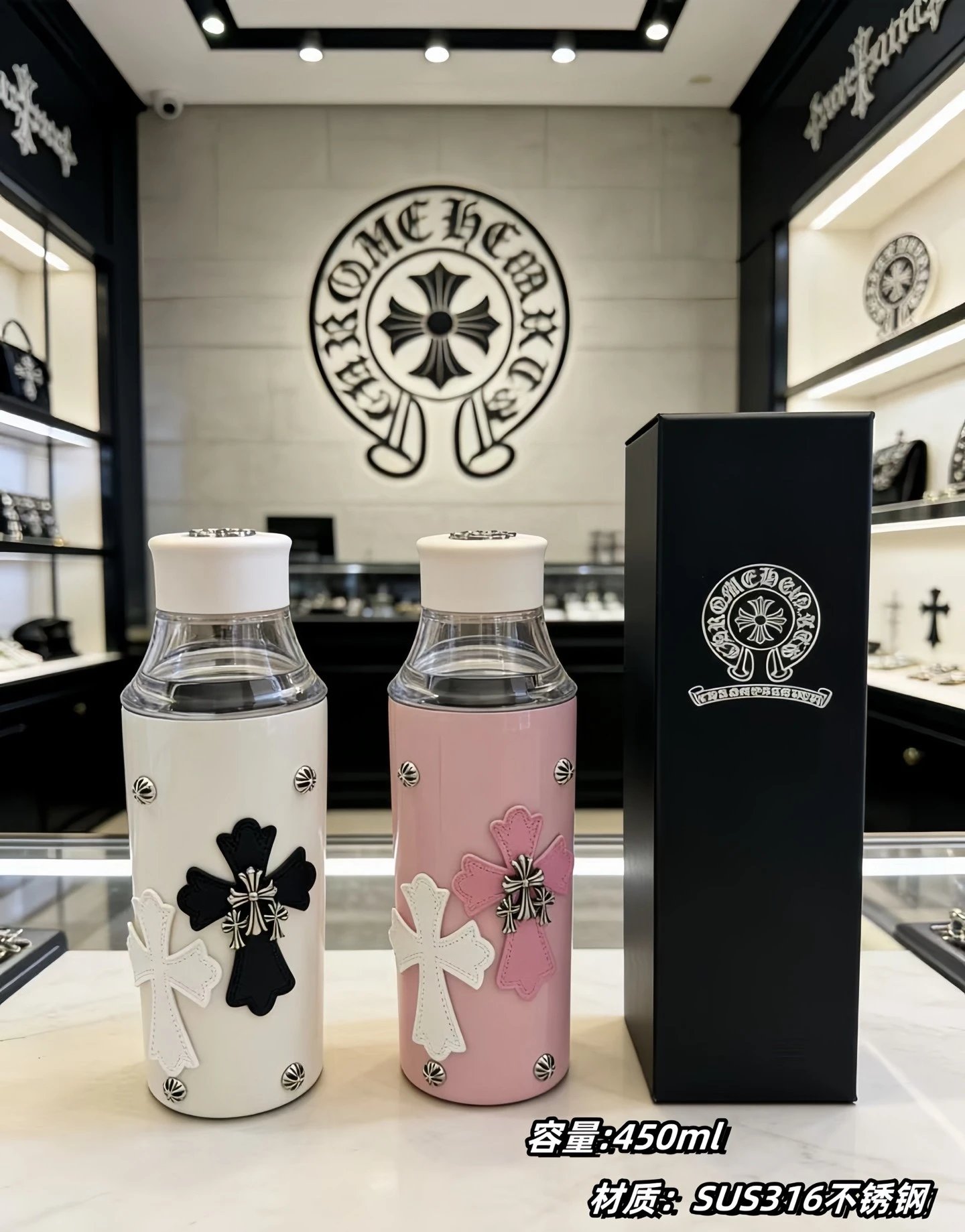 Limited edition streetwear water bottle with silver studs and a 3D cross leather patch. Every detail showcases the brand's iconic design. The clear bottle comes with a premium gift box, making it an ideal gift-ready set.