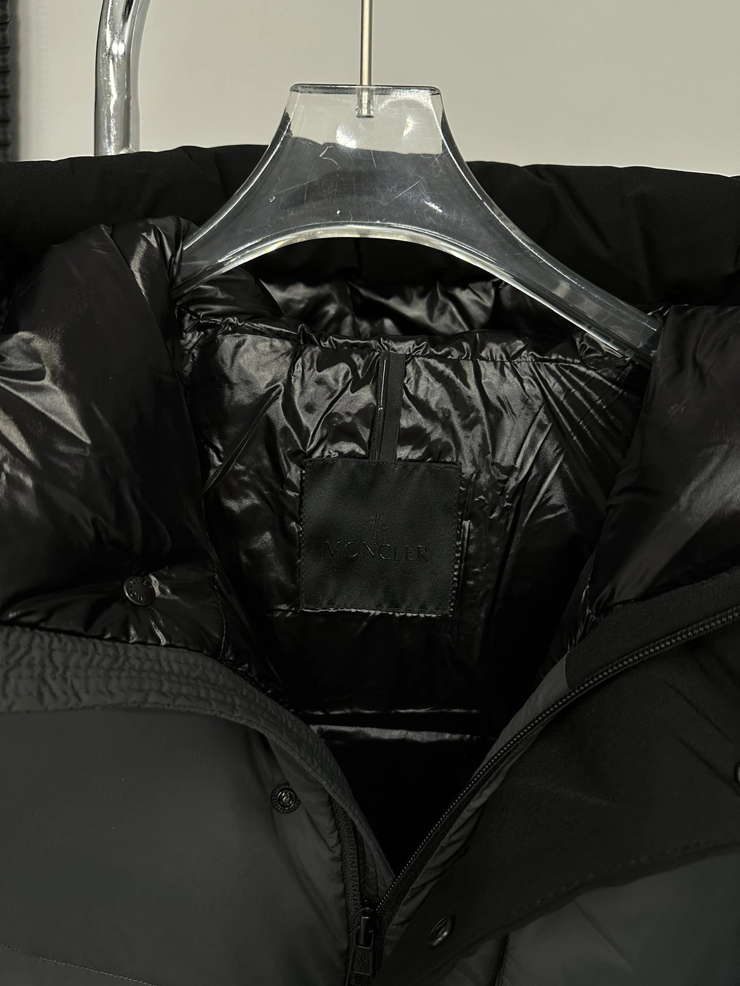 Black Moncler Down Jacket with Detachable Hood and Zippered Pockets
