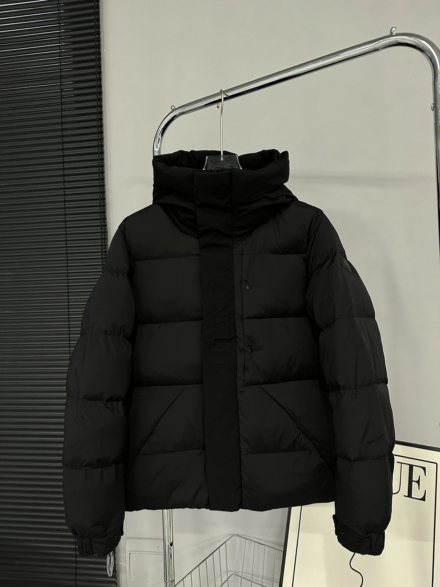 Black Moncler Down Jacket with Detachable Hood and Zippered Pockets