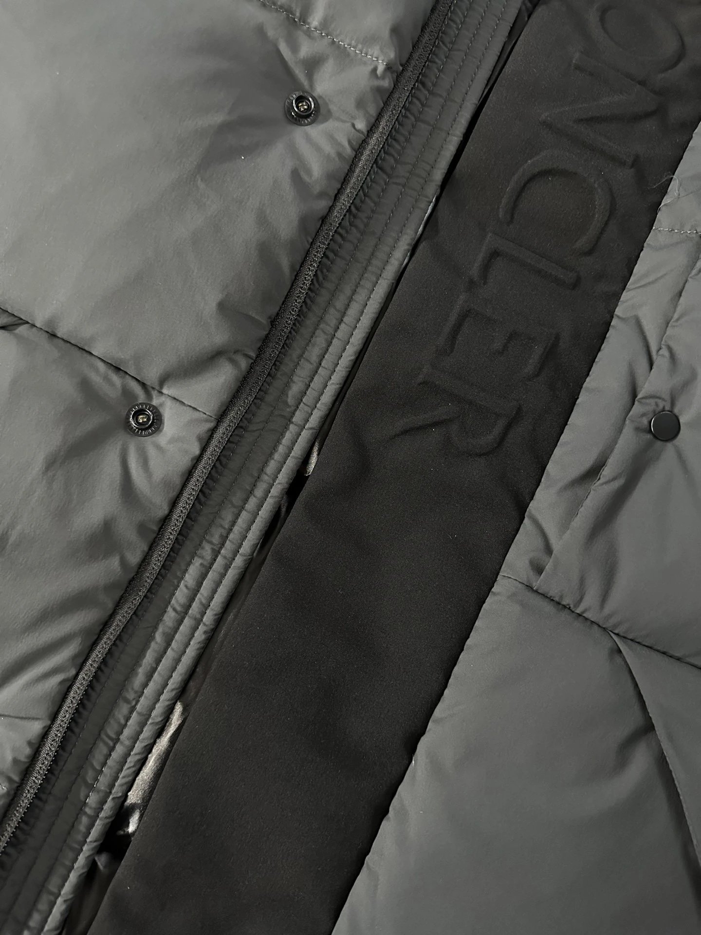 Black Moncler Down Jacket with Detachable Hood and Zippered Pockets