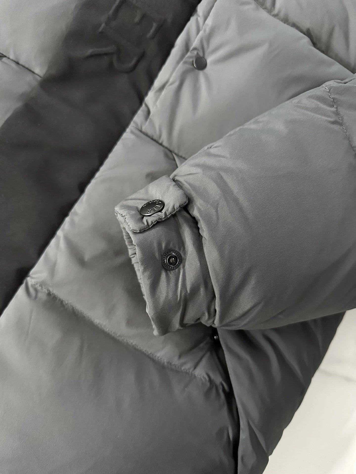 Black Moncler Down Jacket with Detachable Hood and Zippered Pockets