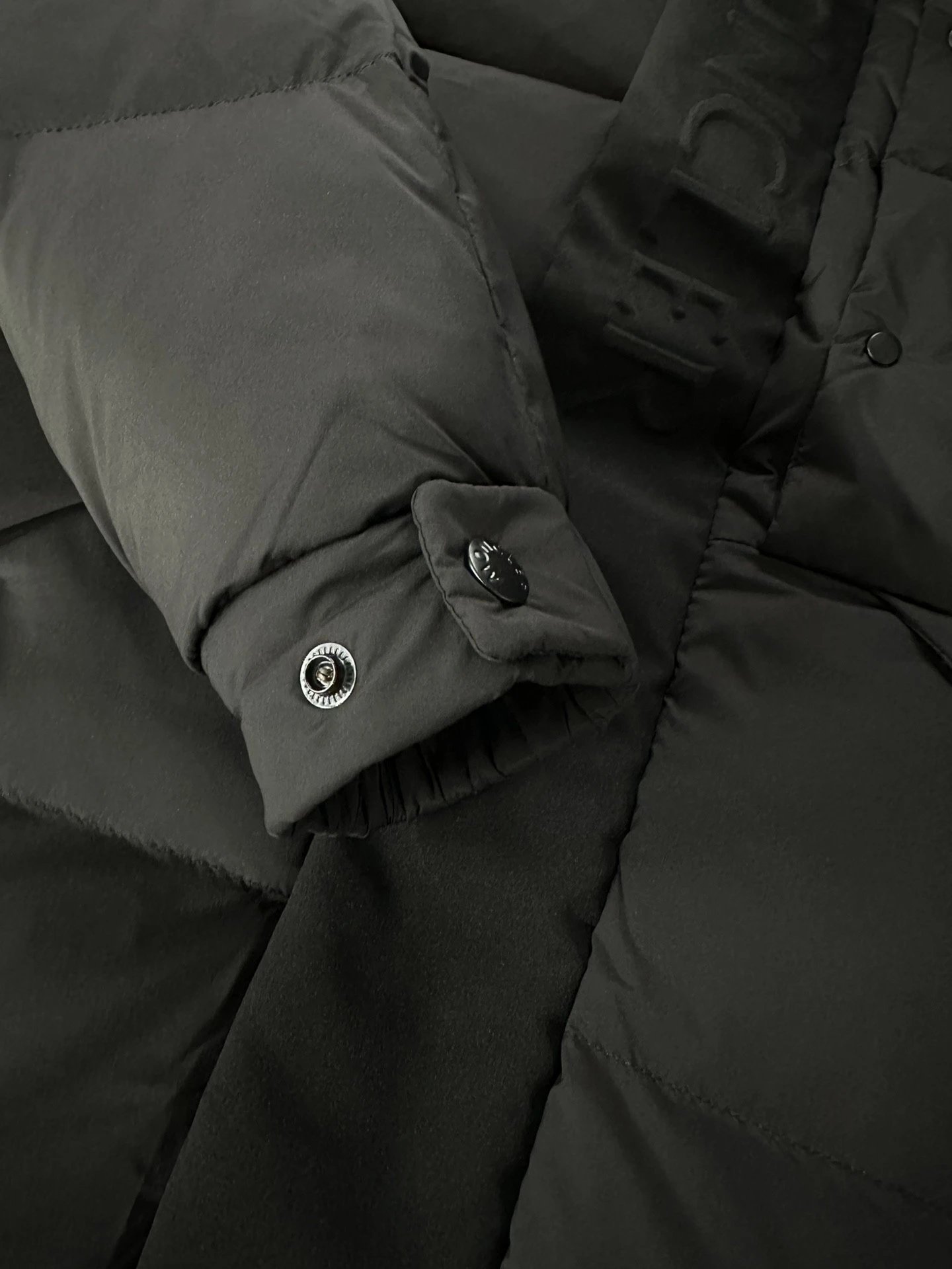 Black Moncler Down Jacket with Detachable Hood and Zippered Pockets
