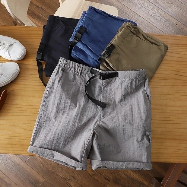 Waterproof nylon cargo shorts with snap closure